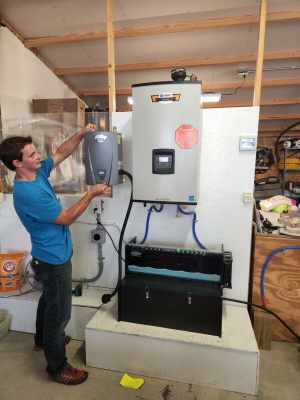 The state pro combi-boiler with eht ehug hydronics tank. Randy is holding up the smaller, less expensive, in line water heater that is another choice