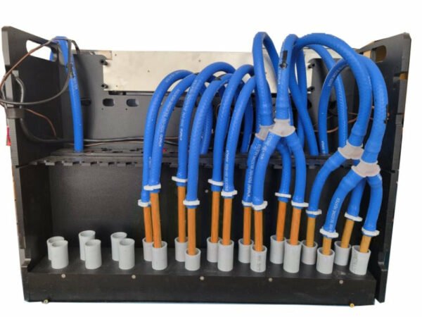 actual photo of back of the HUG Hydronics in floor heating system. The blue hoses connect to the orange pex pipes and are clamped with white clamps