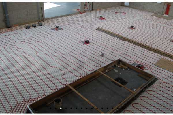 pex pipe layout on a floor, using heat-sheet insulation in preparation for in-floor heating